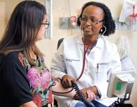 Dr. Marwah Abdalla, cardiologist, with a patient